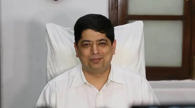 Niket Kaushik, IPS, photographed in civil dress at his office desk.